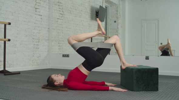 Fitness Woman Doing Banded Glute Bridge Exercise