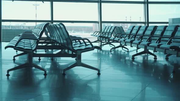 Empty Departure Lounge with Seats Marked Unavailable