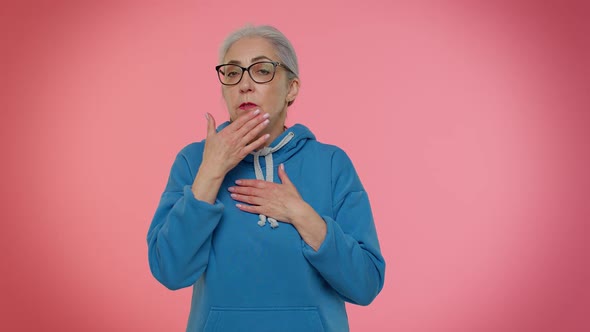 Frightened Elderly Woman Closing Her Mouth with Hand Gestures No Refusing to Tell Terrible Secret
