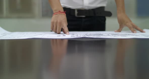 Man Open Blueprint Paper alt