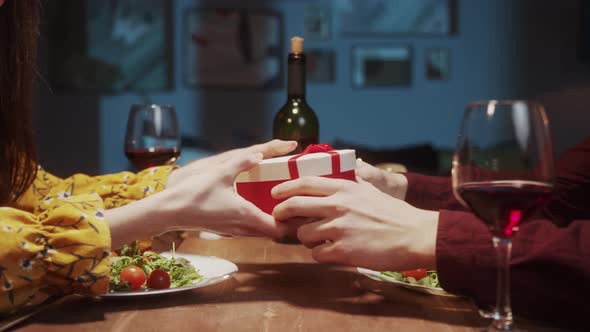 Surprised Woman Opening Gift a Red Box