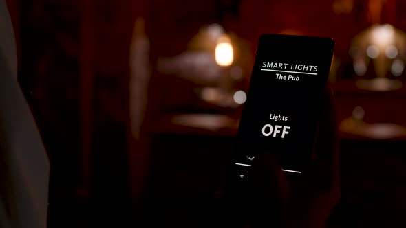 Bartender Using a Smart Home Application To Turn ON the Lights