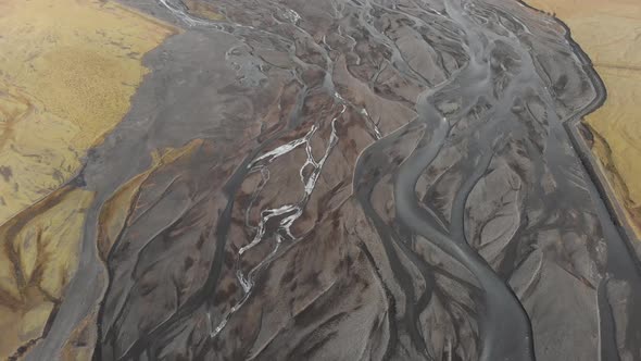 Aerial shot of a glacial river system in Iceland showing unique patterns.