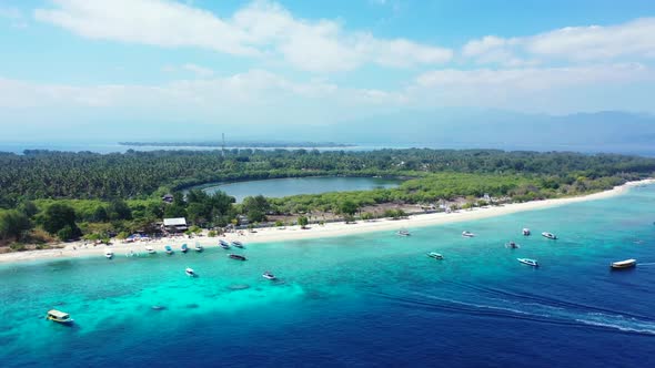 Aerial flying over travel of perfect tourist beach lifestyle by turquoise water and bright sandy bac