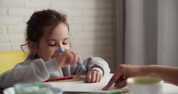 Mother Teaching Daughter to Draw