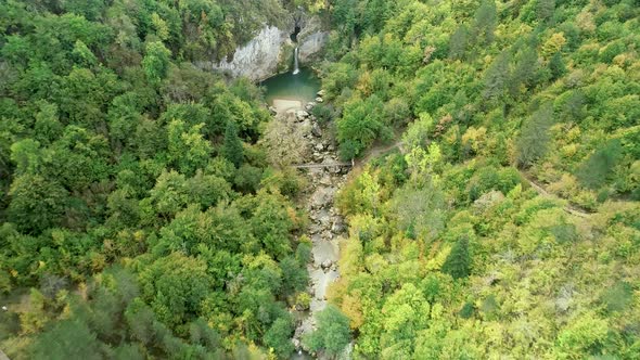 Waterfall among autumn colors.