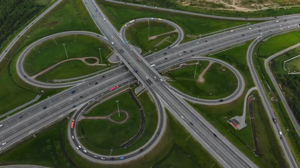 Heavy Traffic on Motorway with Multilevel Intersections