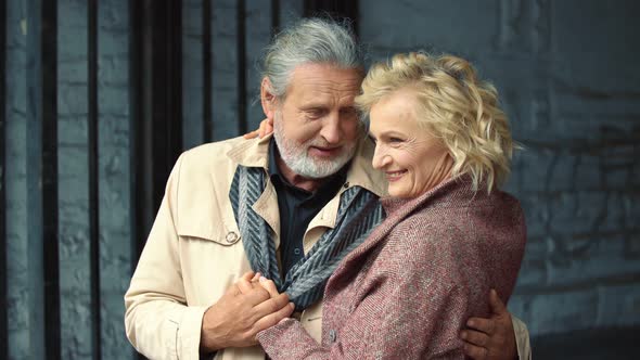 an Elderly Couple Walking the Streets