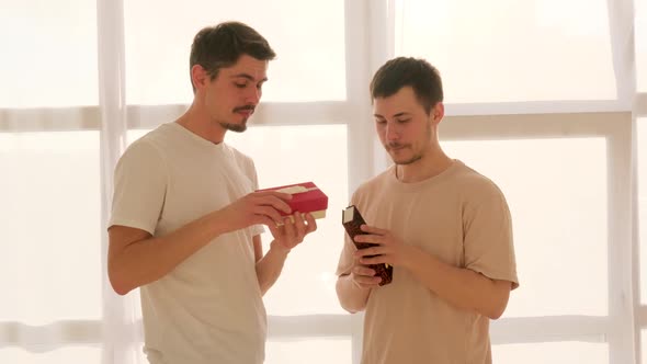Gay Couple Exchanges Gifts