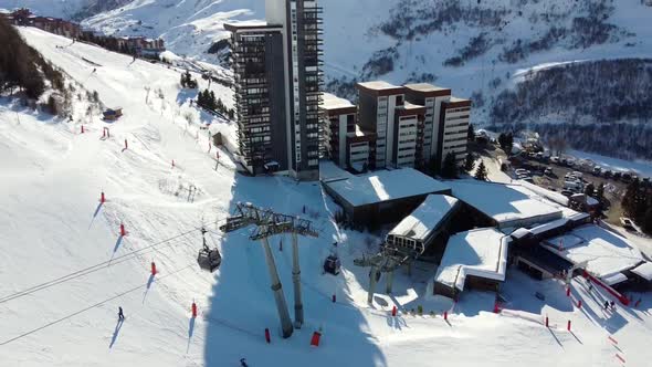 Majestic Winter Aerial Landscape and Ski Resort with Typical Alpine Wooden Houses in French Alps