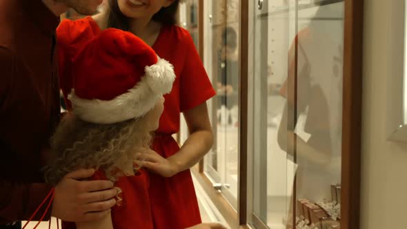 Family with Christmas hat shopping