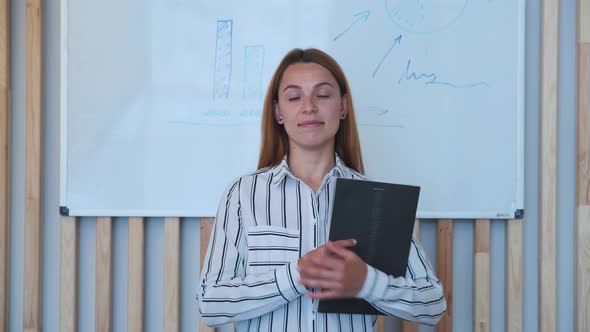 Beautiful Smiling Confident Young Woman Pretty Face Looking at Camera Posing Alone in Office