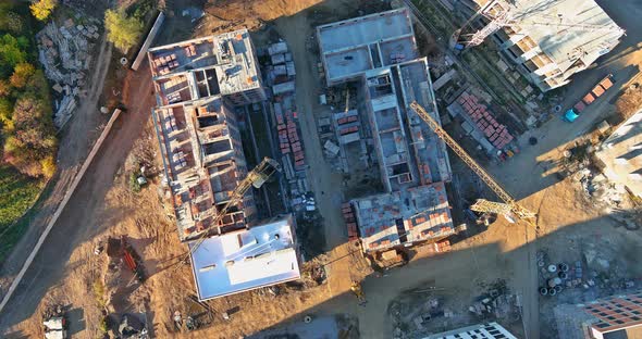 Aerial Top View Building Process of Large Residential Apartment Building with Crane