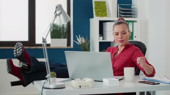 Casual Businesswoman Relaxing at Startup Office Job