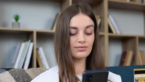 Woman Consumer Paying for Purchase in Web Store Using Laptop Technology