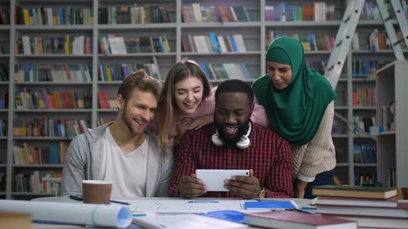 Cheerful Diverse Friends with Tablet Make Videocall