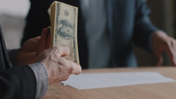 Two Unknown Unrecognizable Businessmen Sitting at Office Table Male Hands of Caucasian Successful