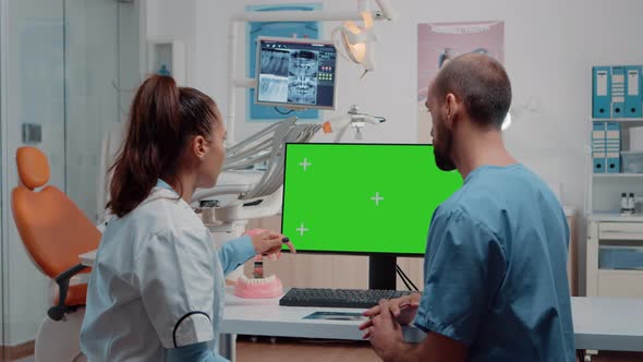 Nurse and Dentist Examining Teeth Layout Using Green Screen