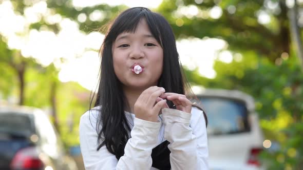 Cute Asian Child Eatting Marshmallow