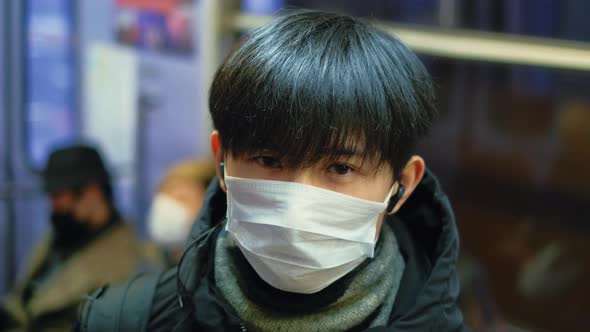 Close-up Portrait in Korea. Respiratory Mask. Korean Man Look at Camera Closeup.