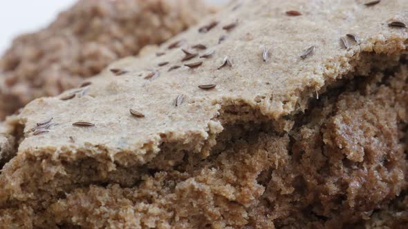 Dark brown tasty bread crust and inside made from full healthy grain and barley  4K 2160p 30fps Ultr