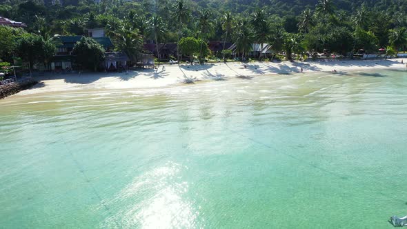 Tropical overhead copy space shot of a white paradise beach and aqua blue ocean background in colorf