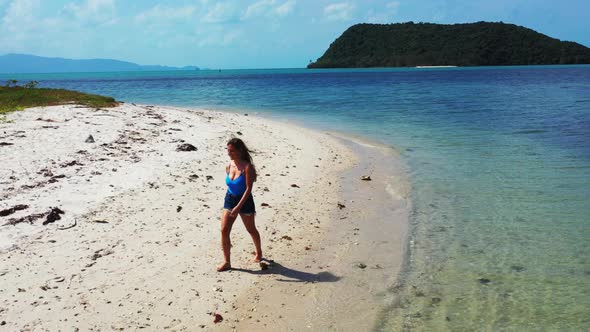 Ladies together enjoying life on paradise resort beach wildlife by transparent water and white sandy