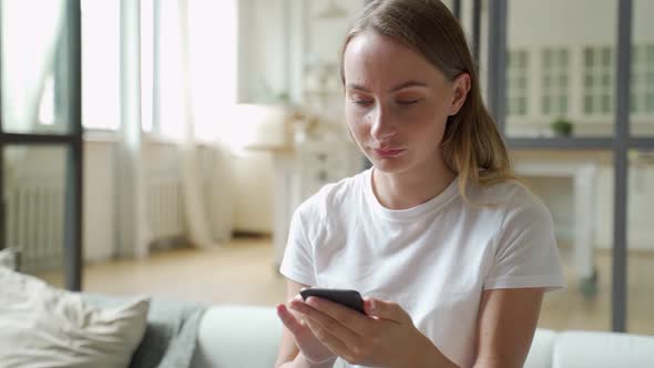 Girl Celebrating Victory Online Using Cell Phone