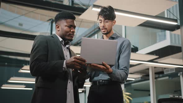 Multiracial Business Partners Stand in Office African Man Banker Male Manager Discuss Online Startup