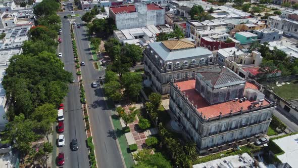 An aerial view of a beautiful city in Mérida. A road is seen in the middle of the city