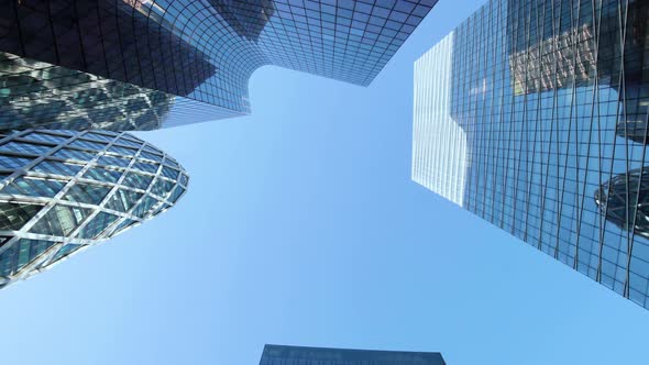 Business district building with wall mirror with blue sky