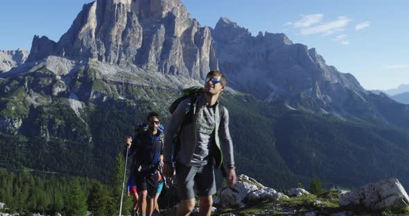 Four Friends Walking Along Hiking Trail Path