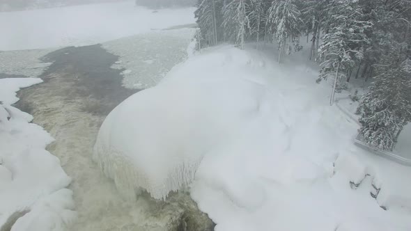 Beautiful ice formation around powerful river created by frigid American winter