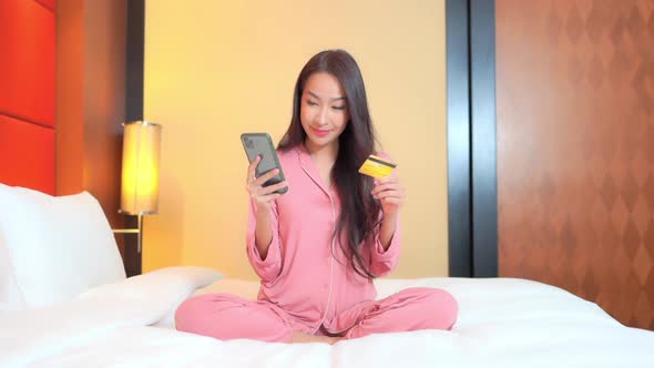 Young asian woman use smart phone