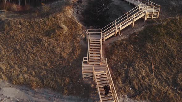 Man Running Down the Stairs