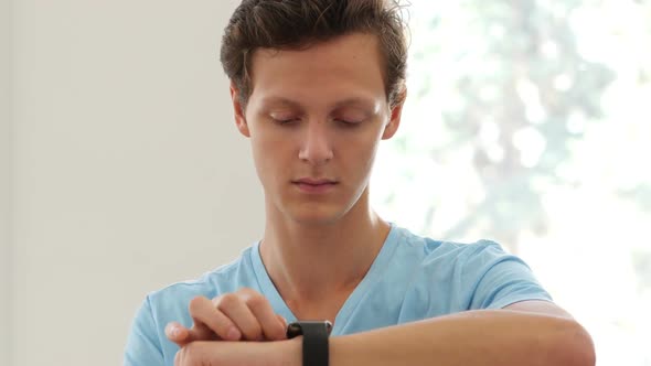 Man Using Smartwatch Applications