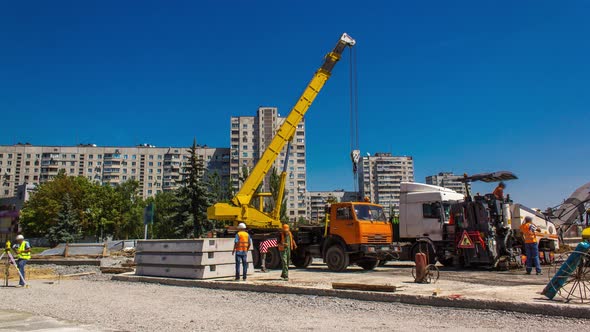 Unloading Concrete Plates By Crane at Road Construction Site Timelapse
