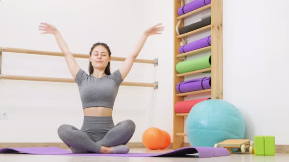 Girl Performs Exercises for Yoga in Gym Gymnastics