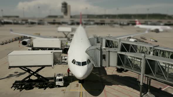 Commercial Airplane Standing at Airport Terminal