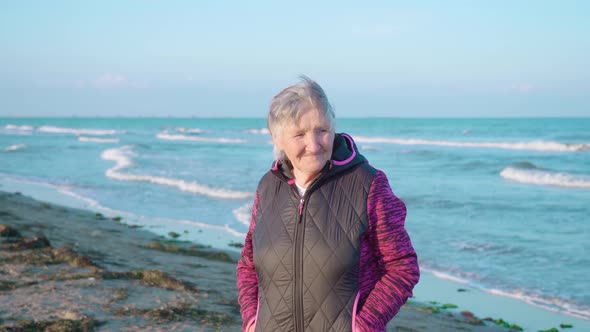 Senior Woman Enjoys Weather in Chioggia with Bright Smile