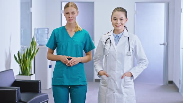 In Front of the Camera Pretty Doctor and Her Nurse