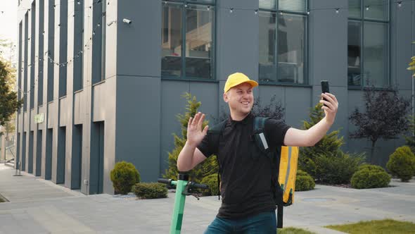 Delivery Boy on Scooter Searching for Address By Asking with Customer on Mobile