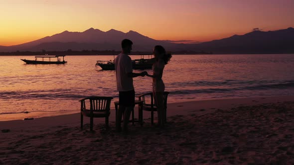 Romantic People on Honeymoon Vacation Enjoy Luxury on Beach on Clean White Sand 