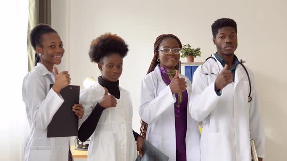 Portrait of African American Medical Team Standing in Modern Hospital