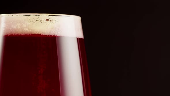 Foamy Cherry Beer in Glass Closeup Belgian Lambic