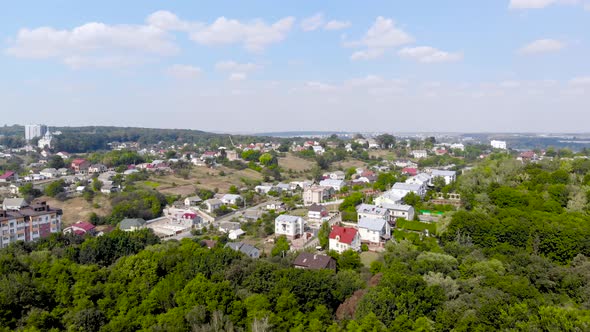 Aerial Shooting of City From the Quadrocopter. City Panorama in Summer.