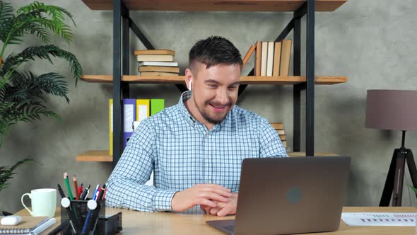 Smiling man teacher greets listen student online video call webcam chat laptop