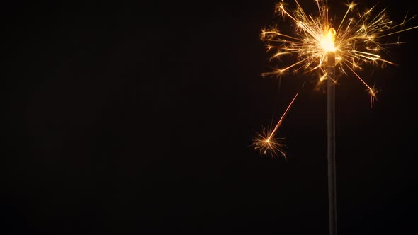 Beautiful Sparks From Cold Stick Fires on a Black Background