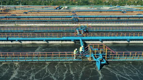 Top View of Industrial Workers at the Biological Cleaning Site