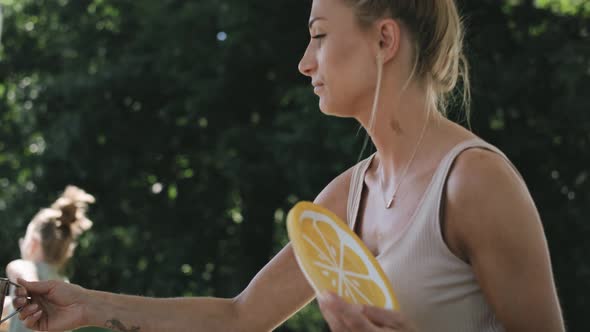 Video of parents drink the juice while the children play. Shot with RED helium camera in 8K.